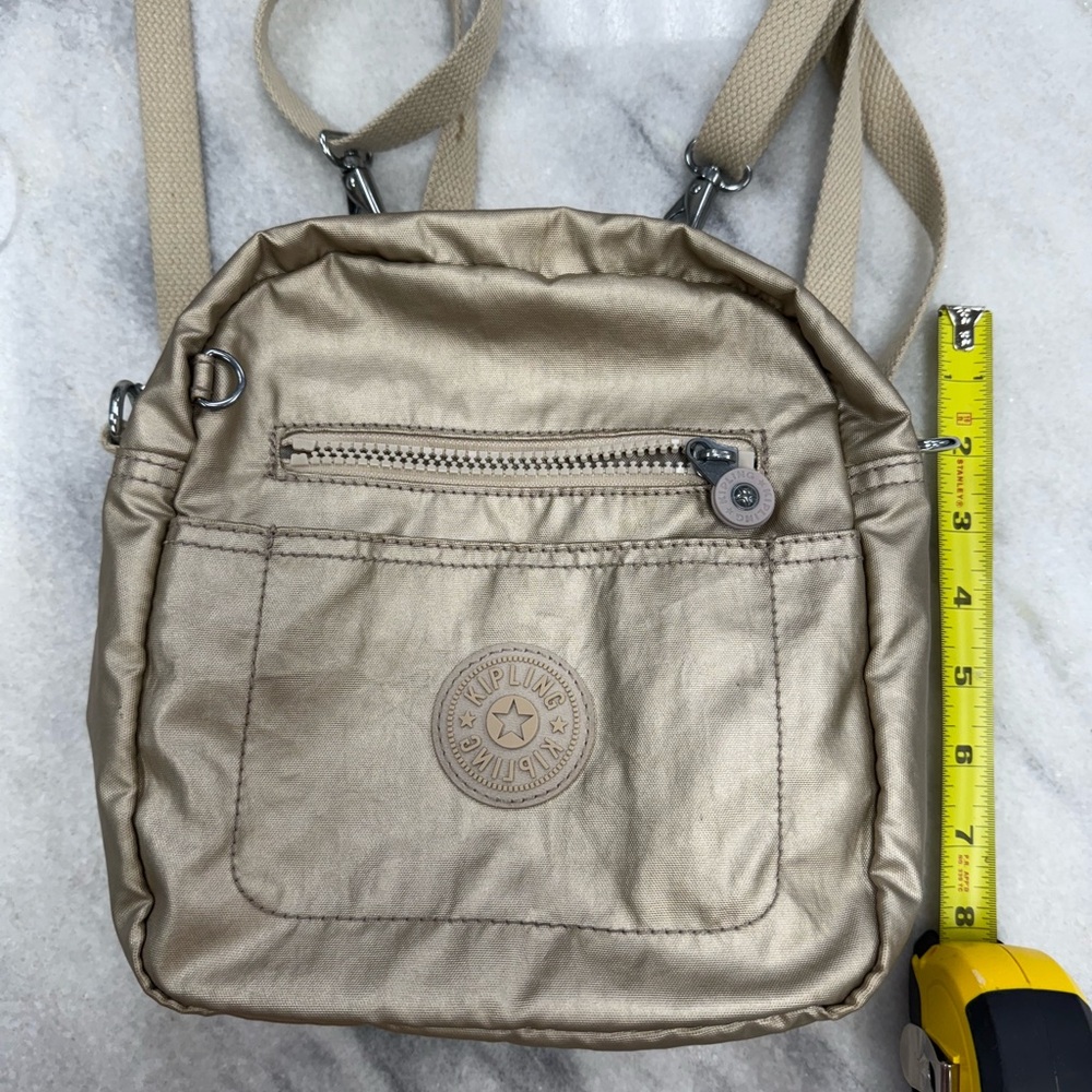 Kipling Gold Backpack With Utilitarian Design - image 1